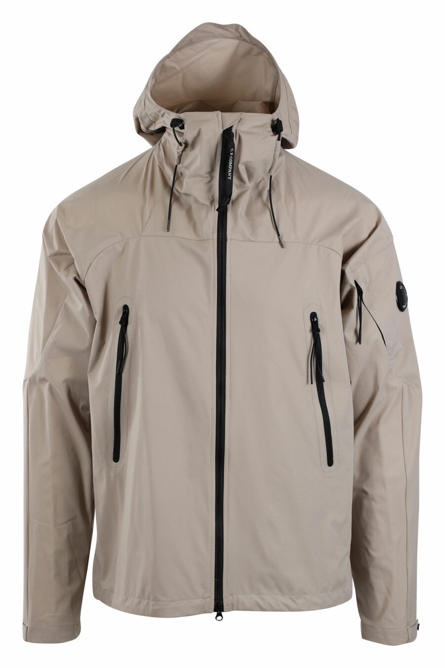 Beigefarbene "pro-tek" Jacke mit Kapuze und kreisförmigem Mini-Logo an der Seite - IMG 2666