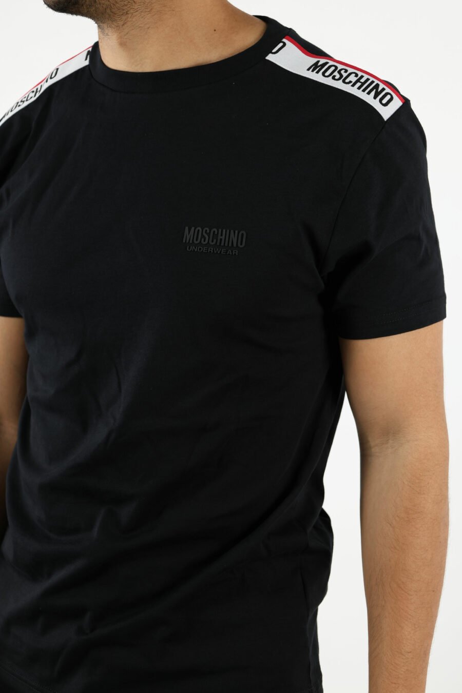 Black T-shirt with white logo with red ribbon detail on shoulders - 110981