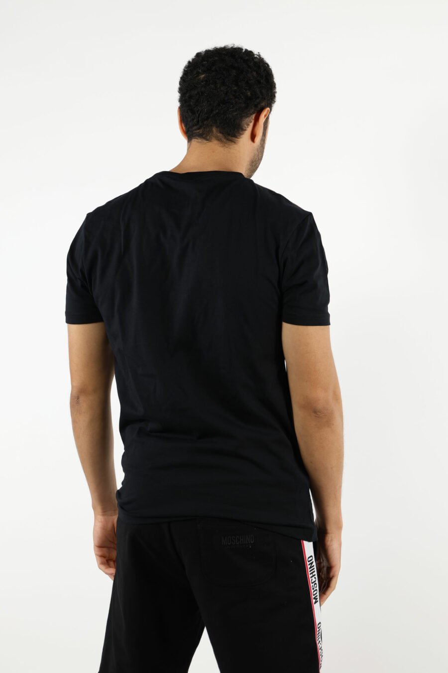 Black T-shirt with white logo with red ribbon detail on shoulders - 110982