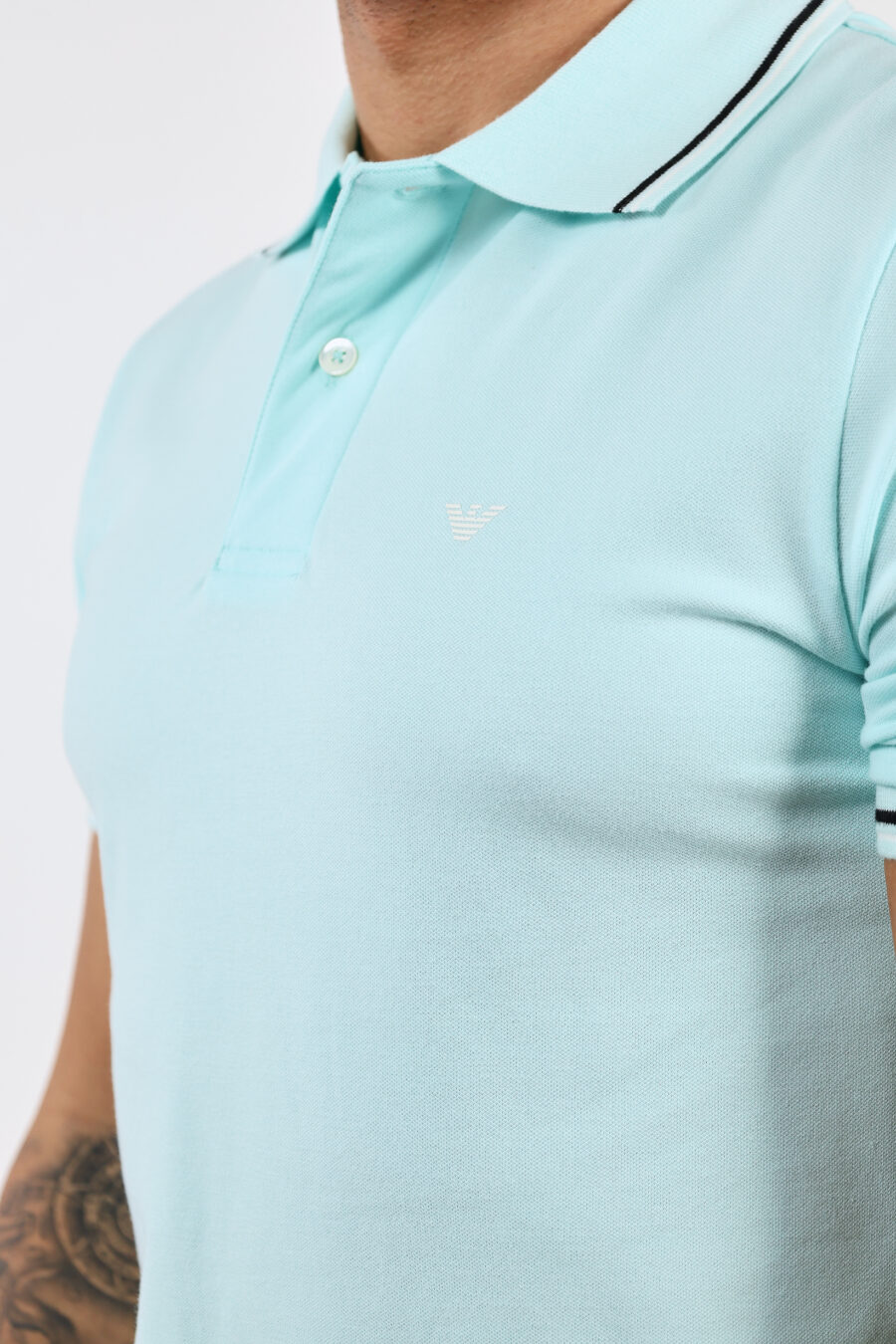 Light blue knitted polo shirt with striped collar and mini eagle logo - BLS Fashion 39