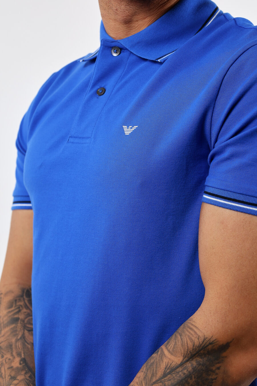 Blue knitted polo shirt with striped collar and mini eagle logo - BLS Fashion 57